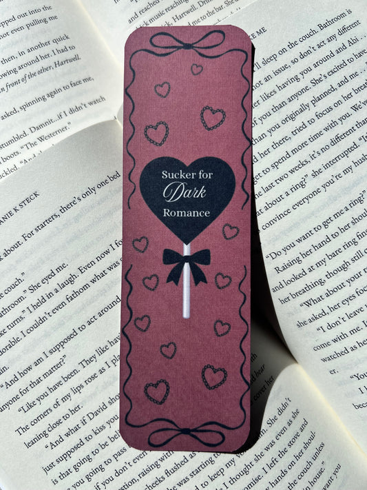 "𝒮𝓊𝒸𝓀𝑒𝓇 𝒻𝑜𝓇 𝒹𝒶𝓇𝓀 𝓇𝑜𝓂𝒶𝓃𝒸𝑒" bookmark